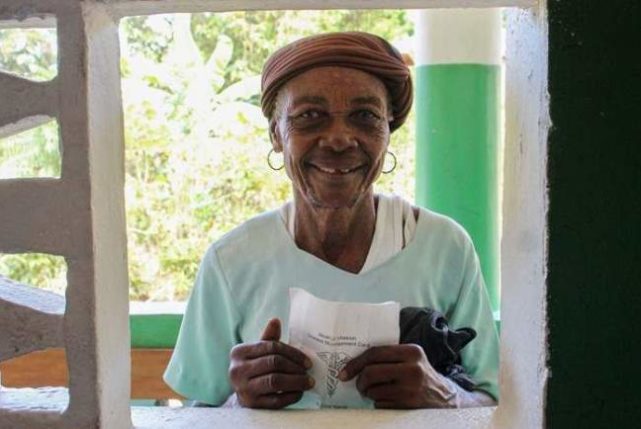 Patient at pharmacy window. Global Health Teams - Haiti Medical Volunteer